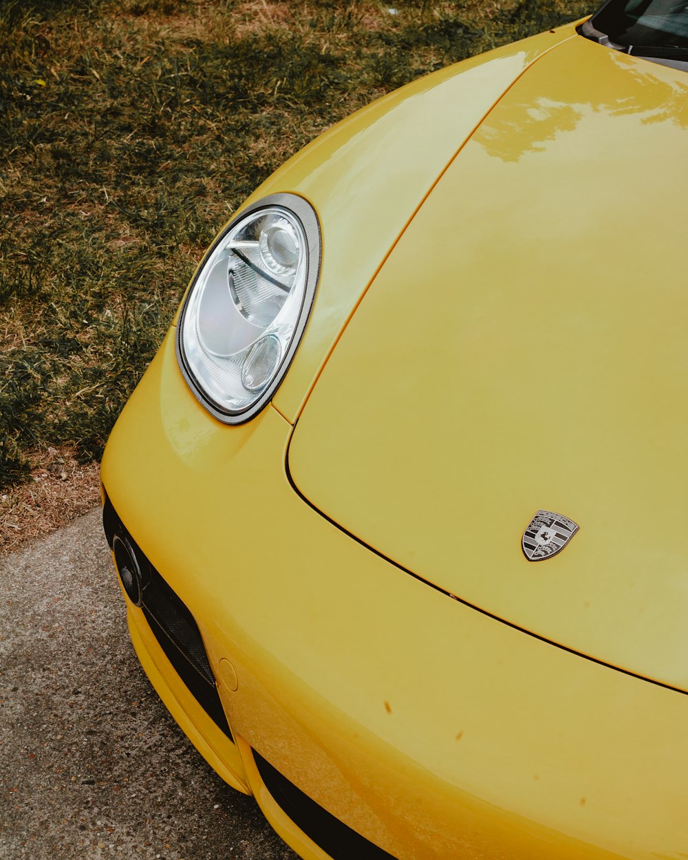 yellow Porsche vehicle during daytime