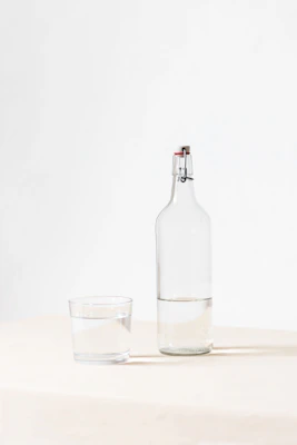Person drinking water showing importance of daily hydration and water intake for health and body function