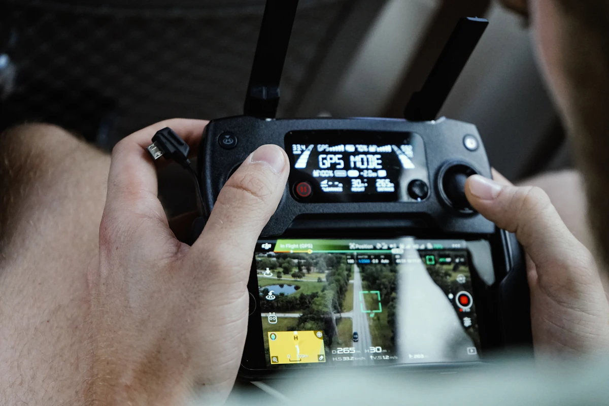 A person holding a drone controller