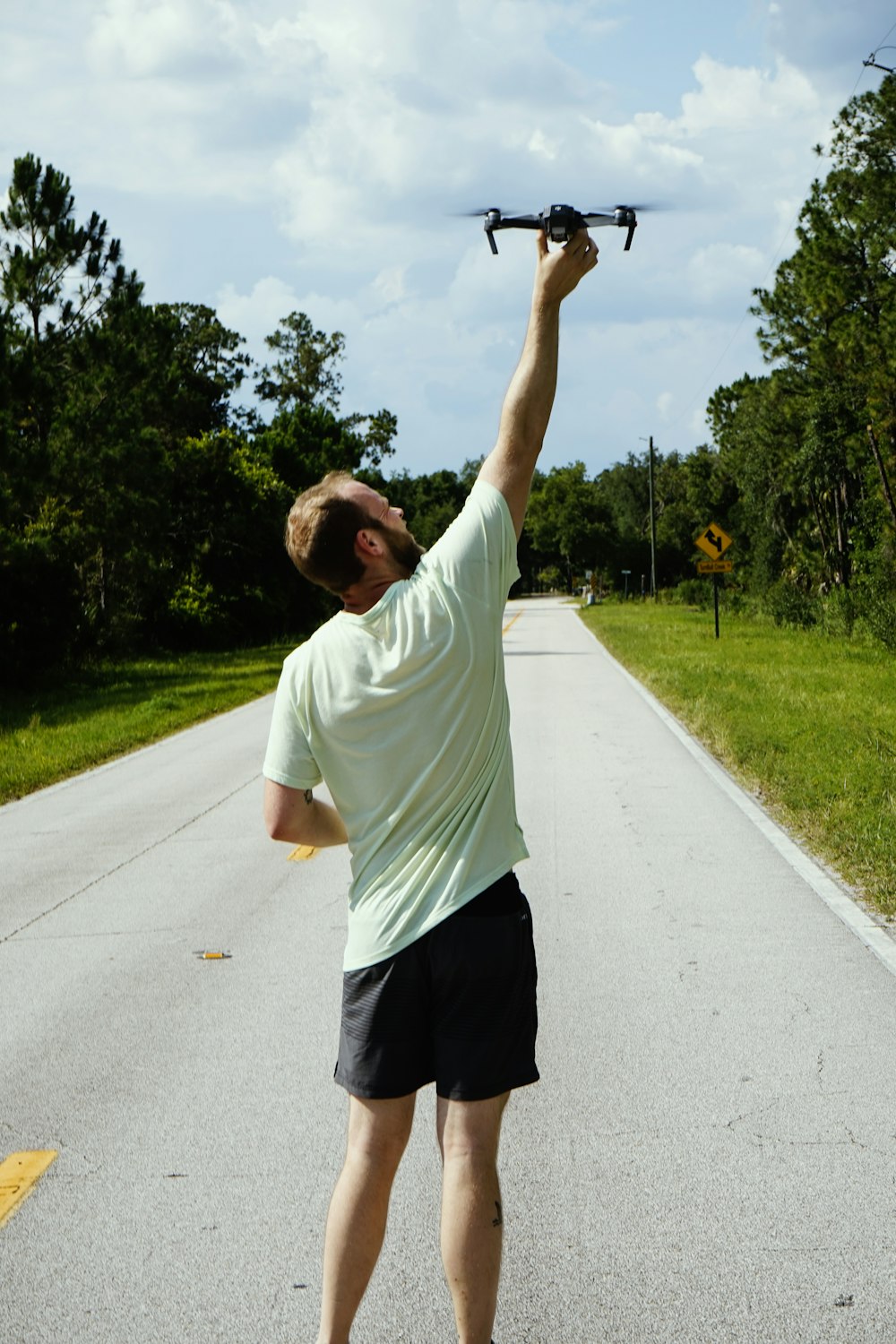 man setting drone on air