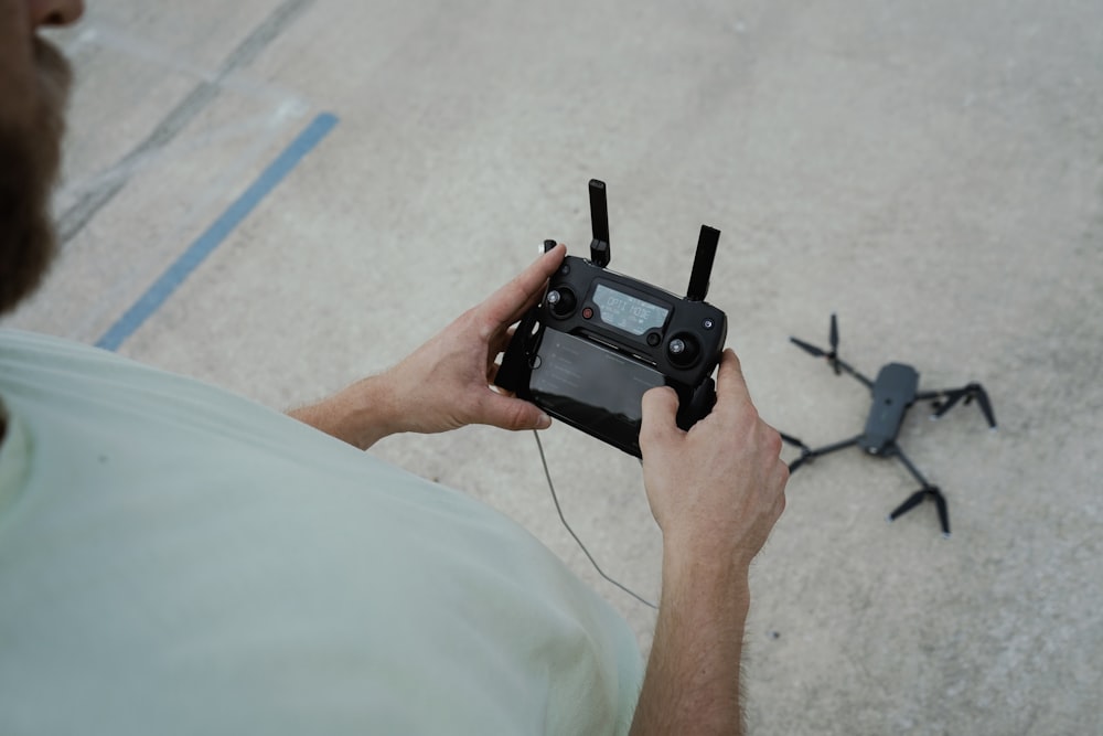 person holding drone remote control