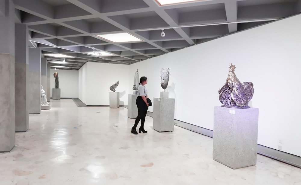 photography of standing woman inside building during daytime