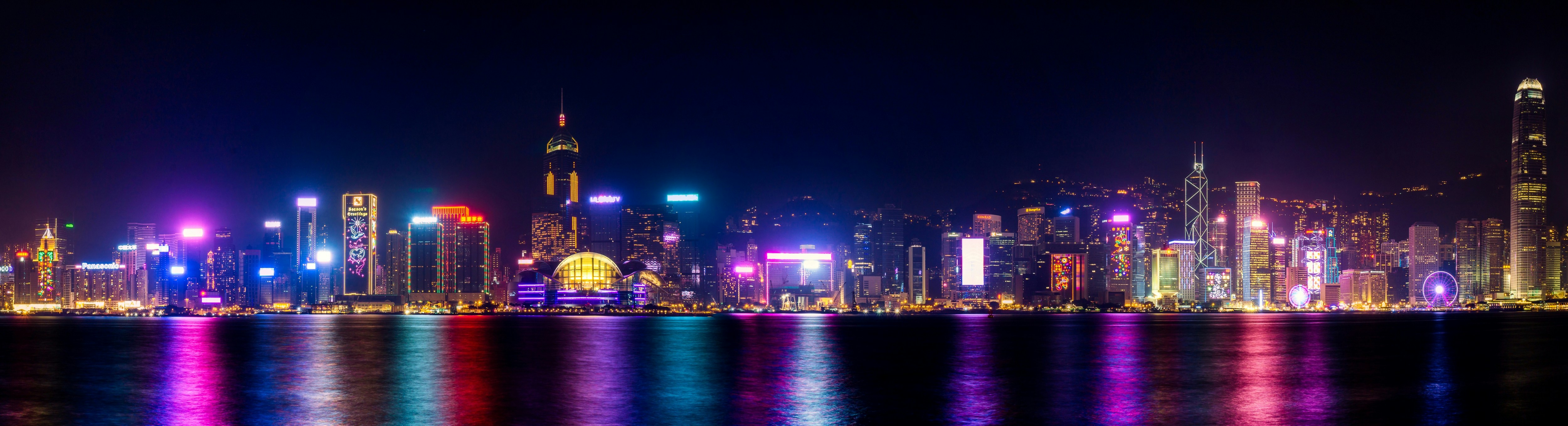 a city skyline is lit up at night, 