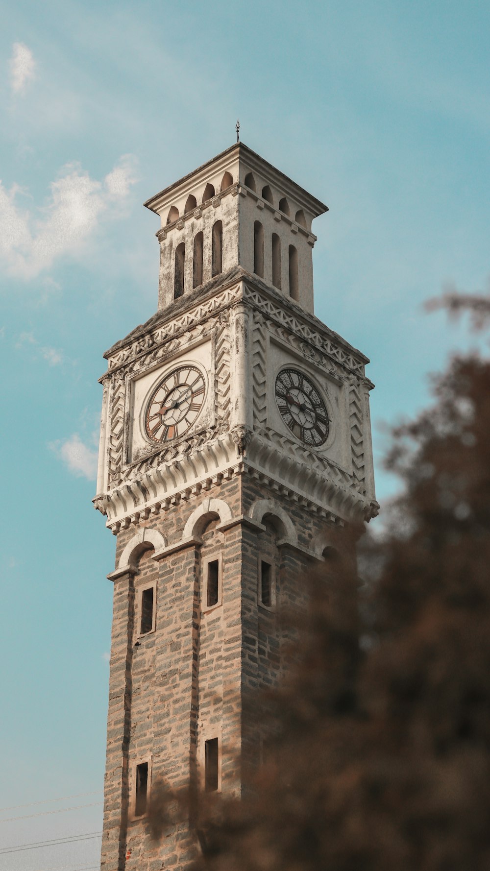 a tall clock tower with a sky background