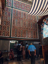 A warm, inviting community gathering with traditional Gujarati decorations.