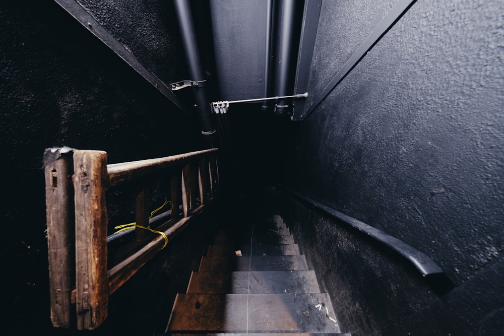 a long narrow hallway with a wooden railing