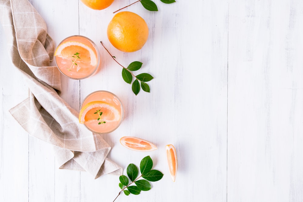 orange fruit on white surface