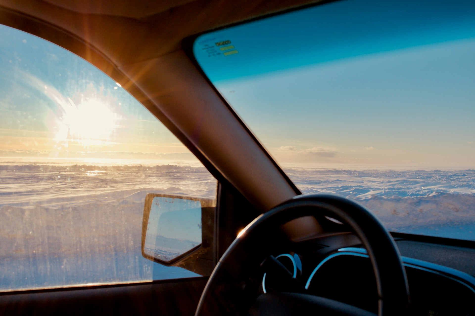 a view of the ocean from inside a vehicle