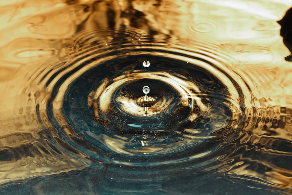 a close up of a water drop in a sink