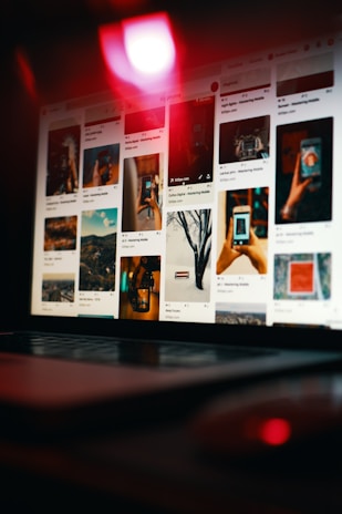 An engaging image of a person using a laptop with Pinterest on the screen.