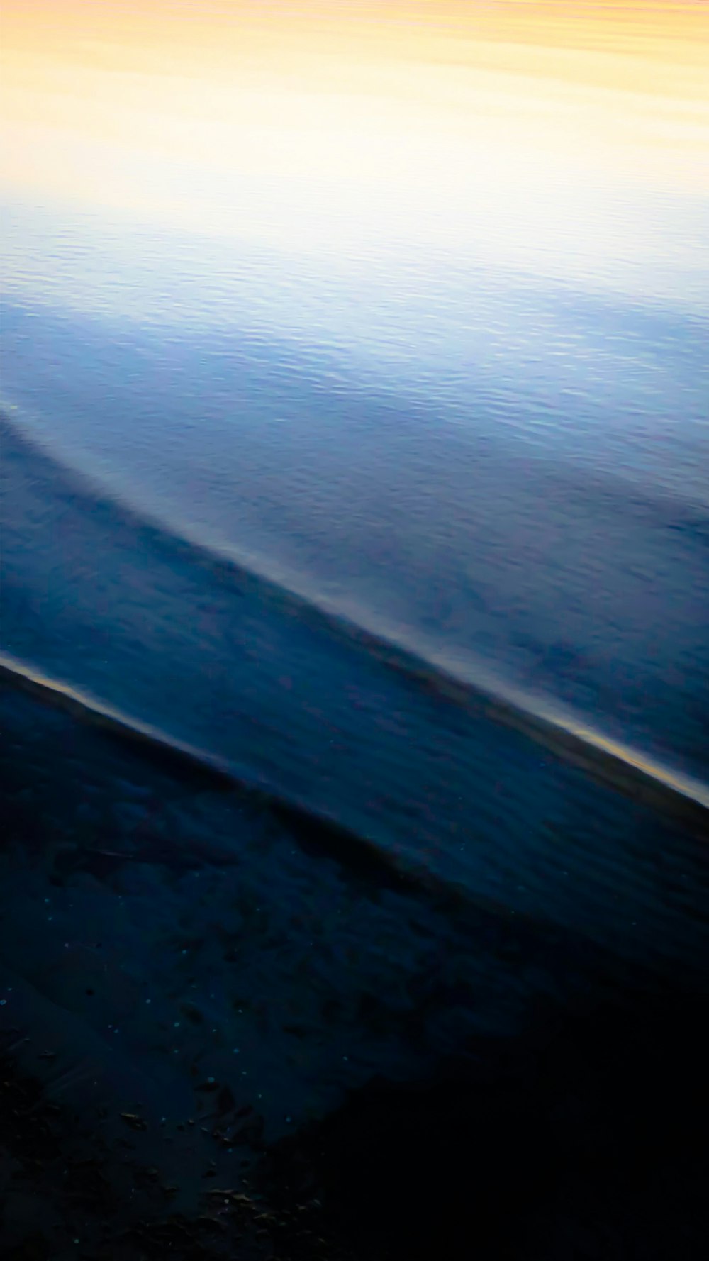 a person riding a surfboard on a body of water