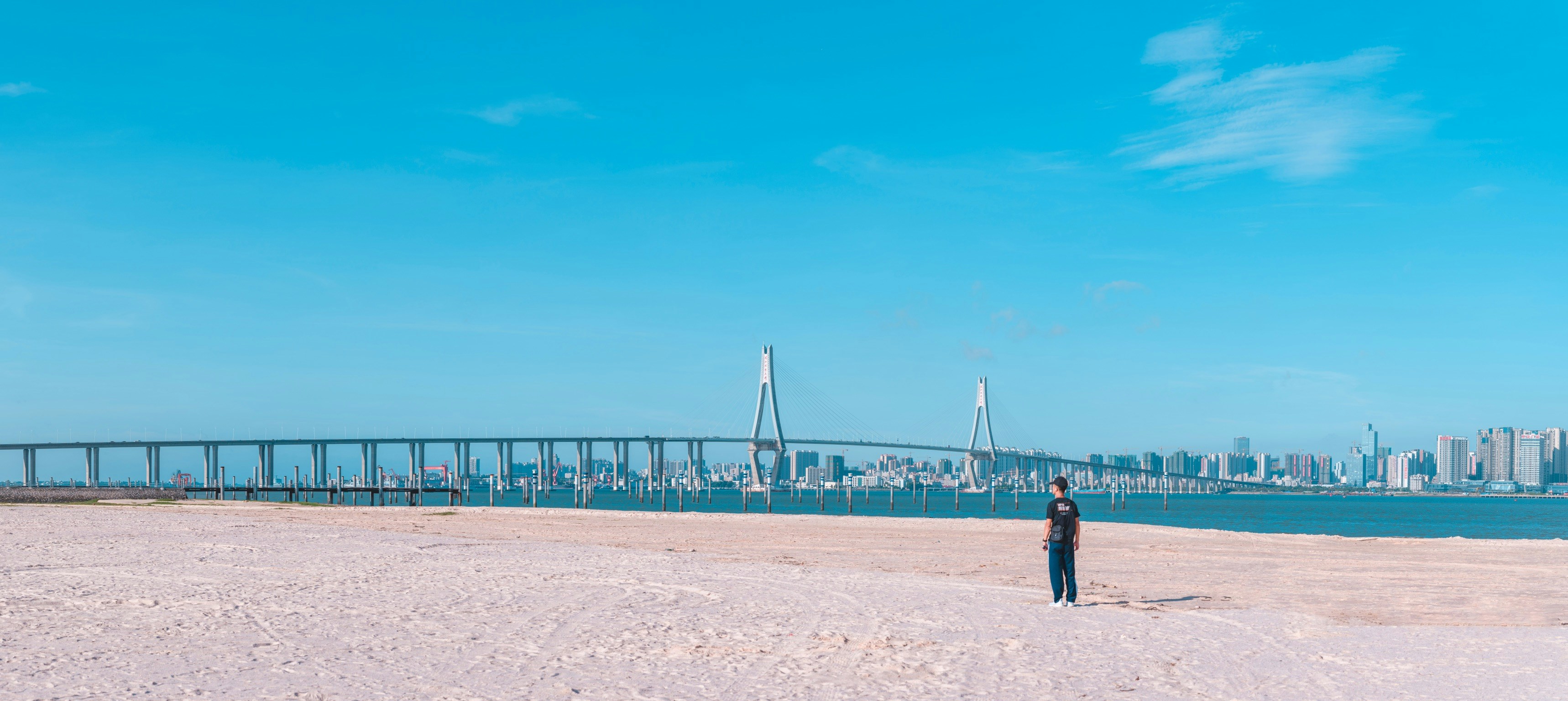 person standing in sand during daytime