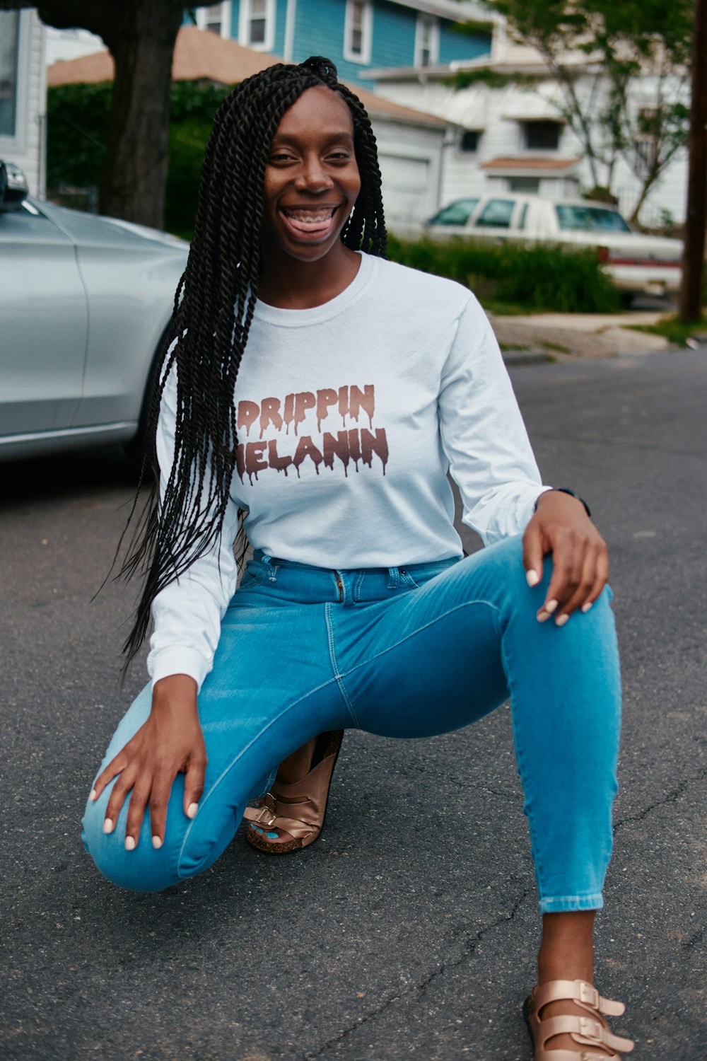 woman sitting on road