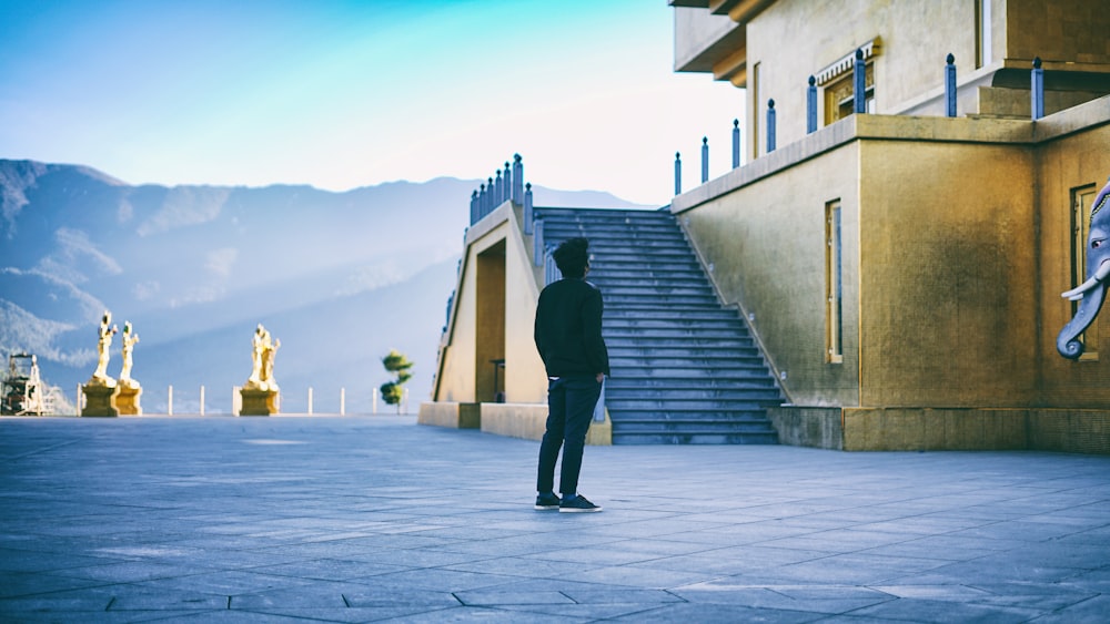 man standing near building