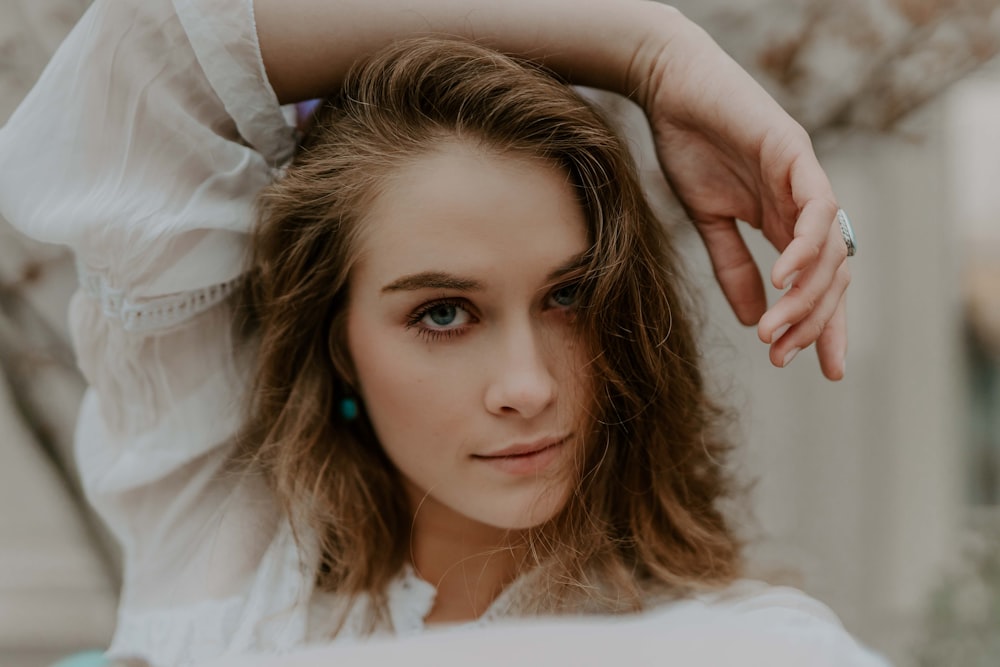 woman wearing white long-sleeved shirt