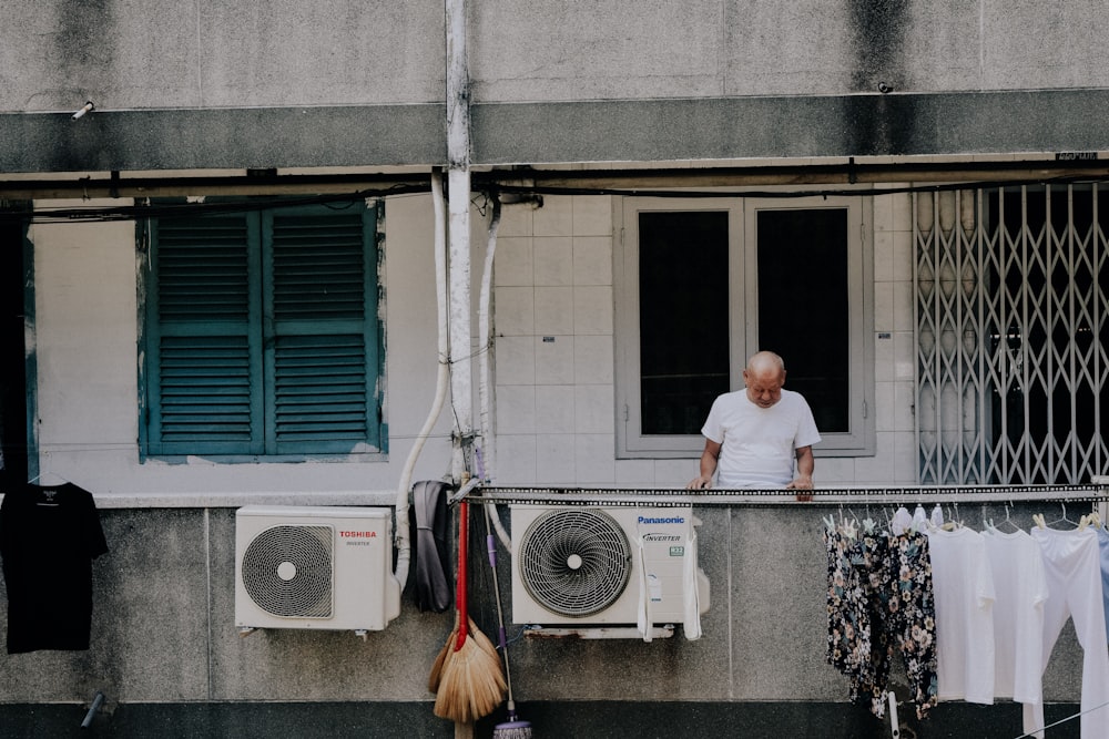 man looking downward at the apartment