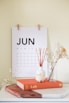 vase on book near calendar