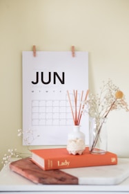 vase on book near calendar