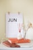 vase on book near calendar