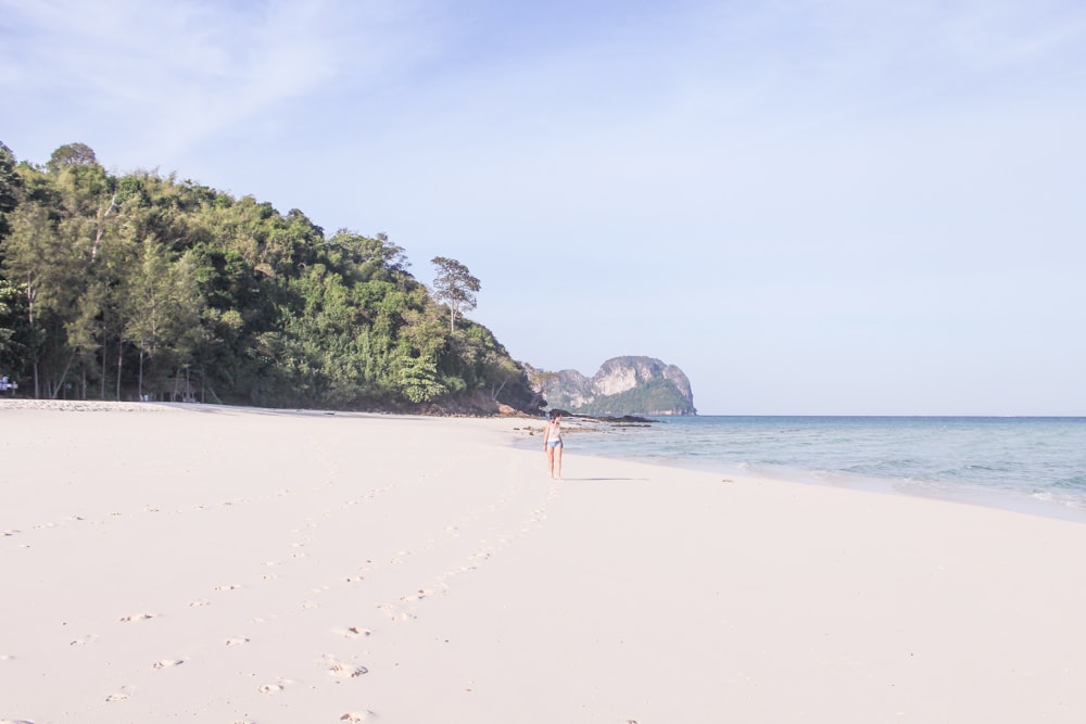 woman standing on shore