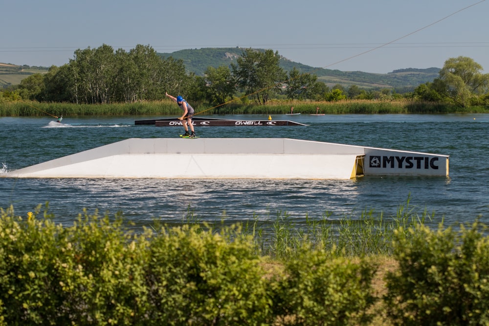 white Mystic boat during daytime