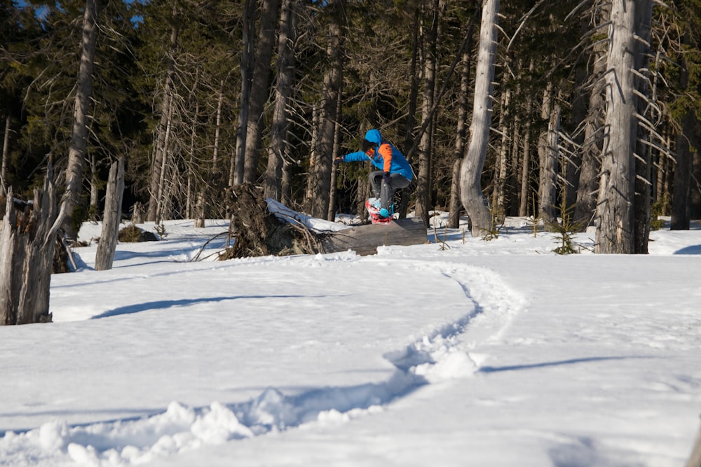 man riding snowboard