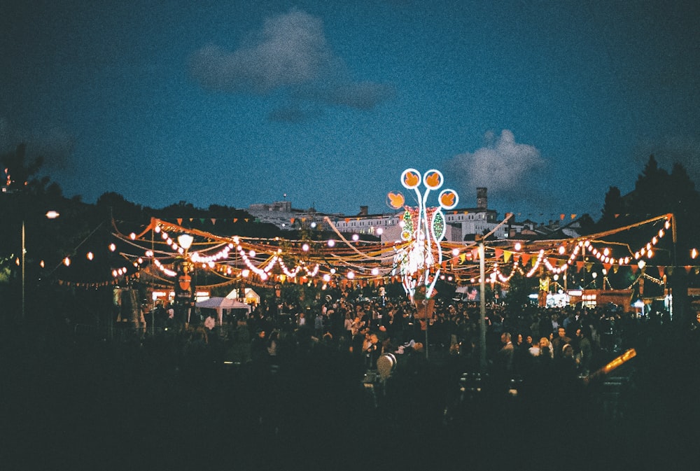 people under roof of mini string lights