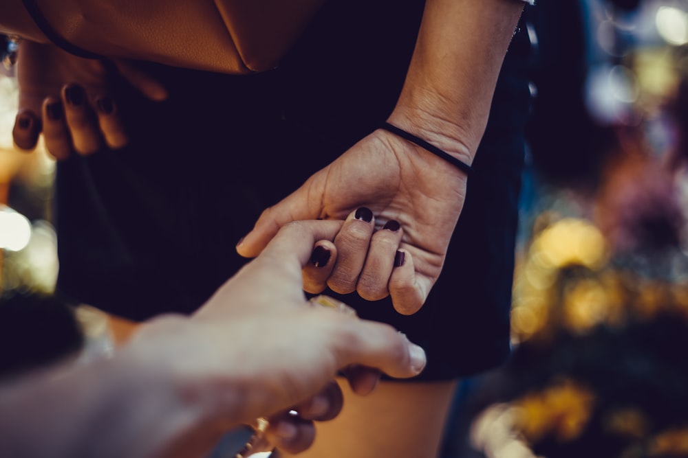 woman holding hand