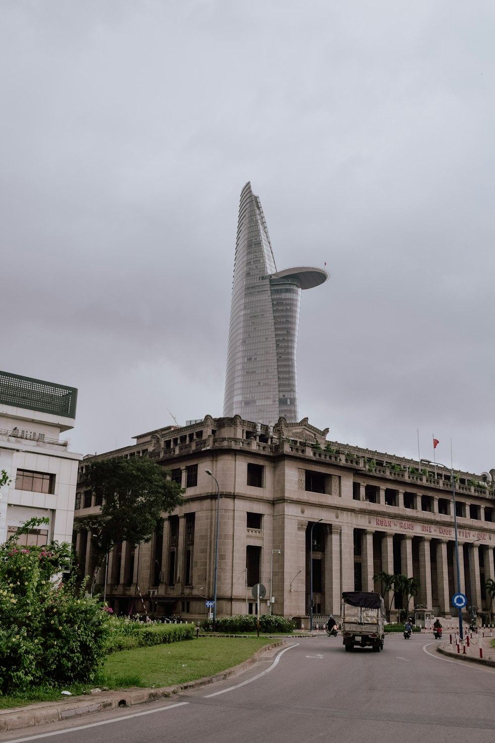 skyscraper behind concrete building