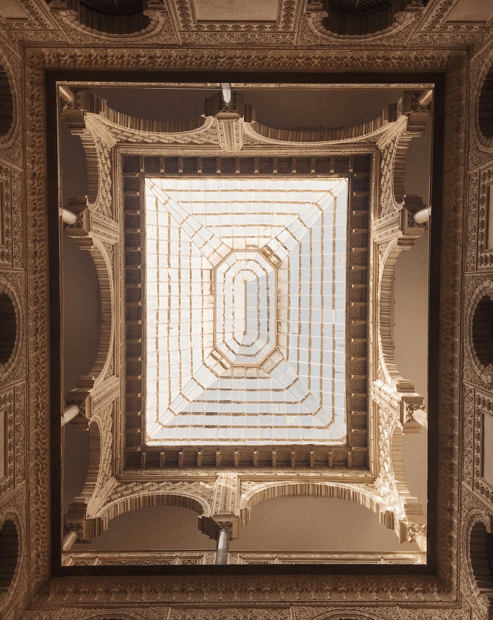 a ceiling in a building with a square pattern
