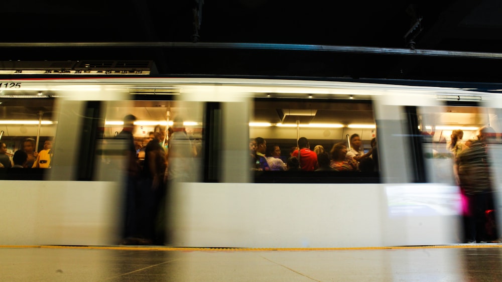 a blurry photo of a subway train at night