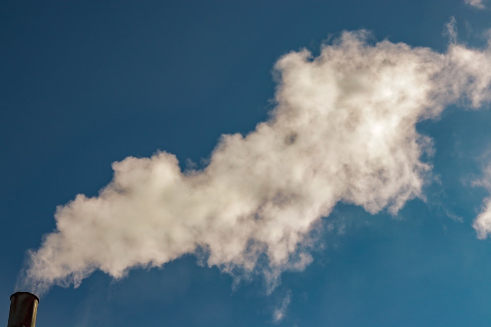 Smoke coming out of a chimney.
