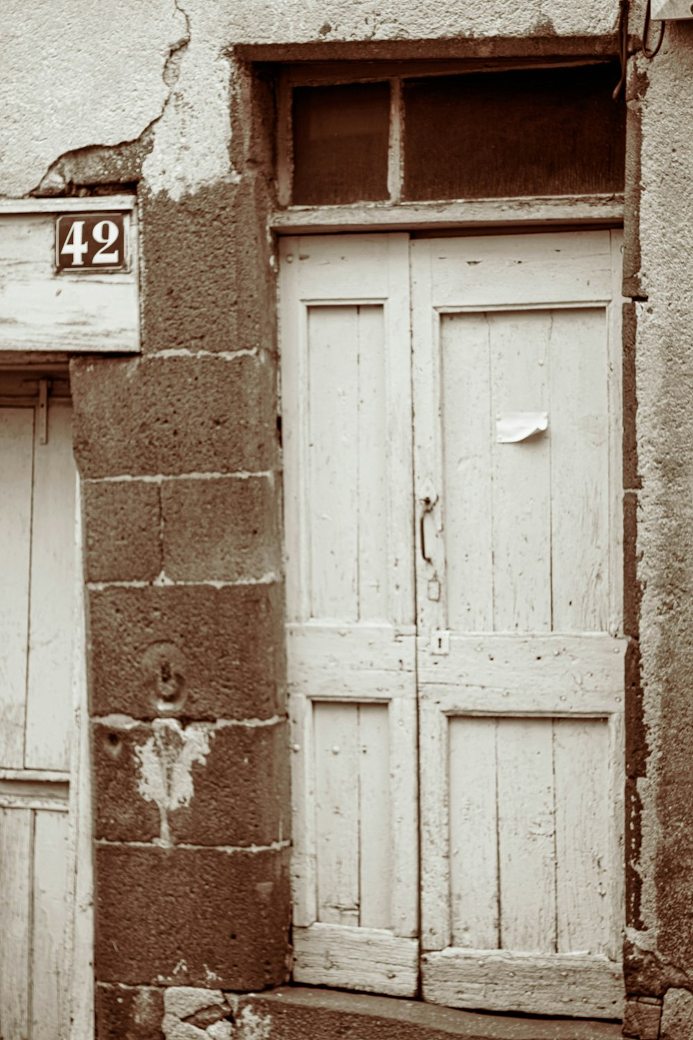 white wooden door number 42