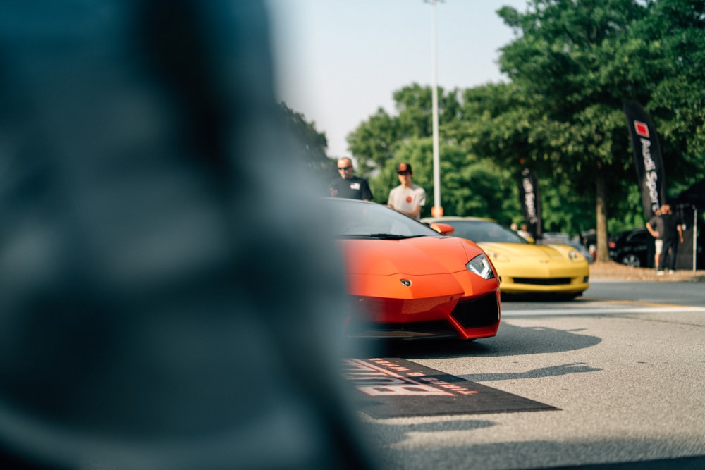 orange car on paved road