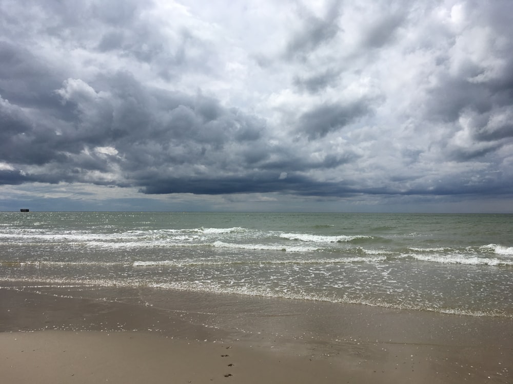 body of water and clouds