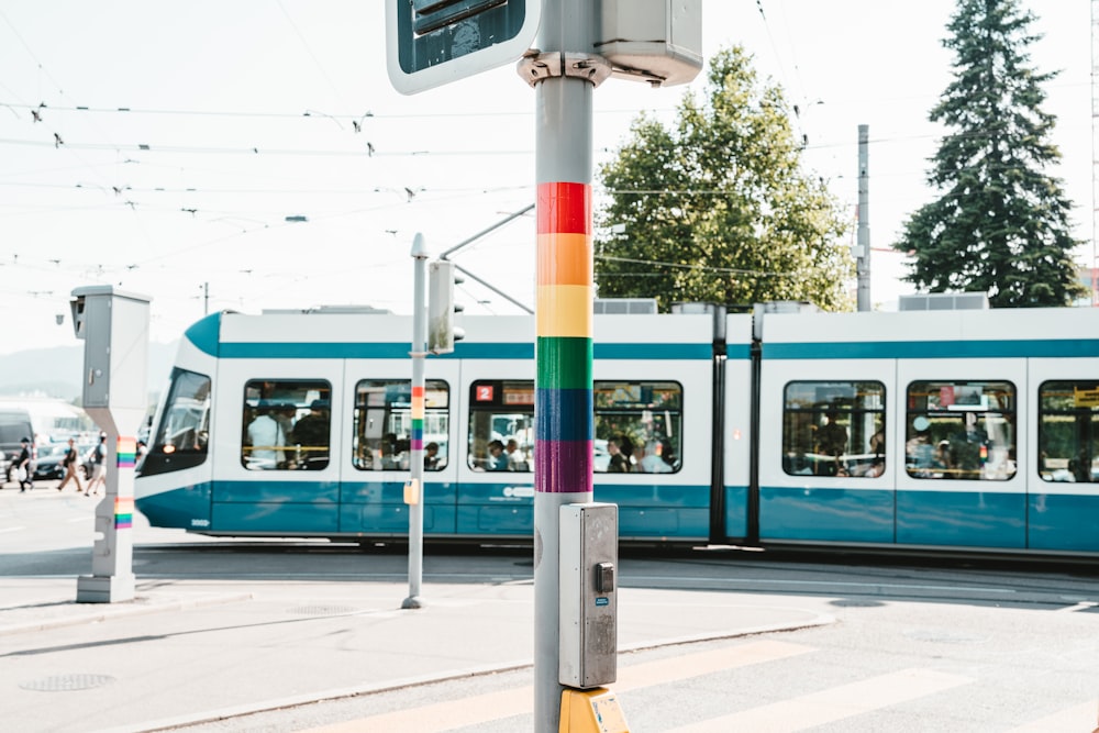 white and teal train during daytime