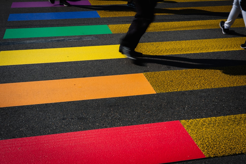 orange, red, gold, green, and blue pedestrian