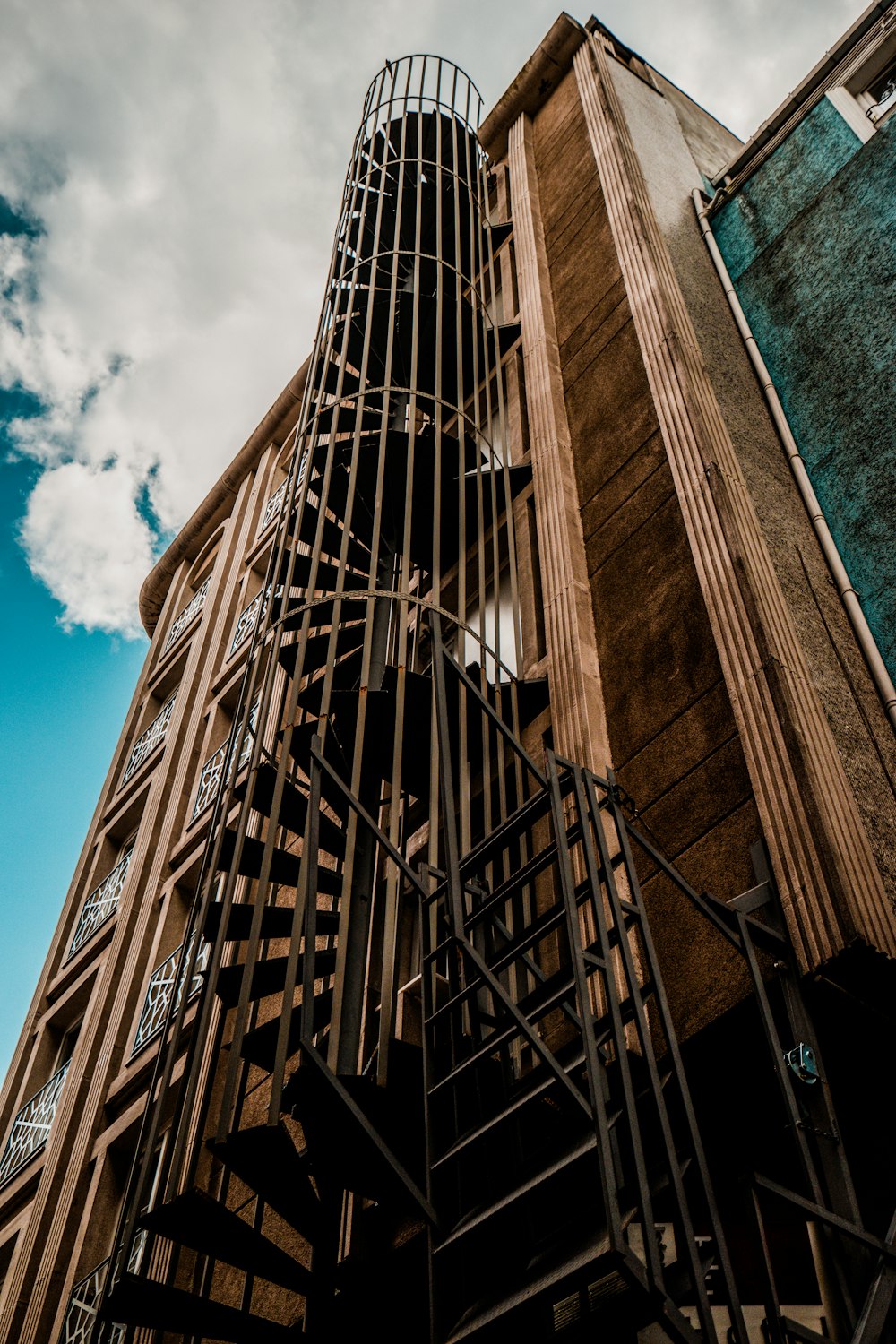 worm's eye view photography of fire exit stair