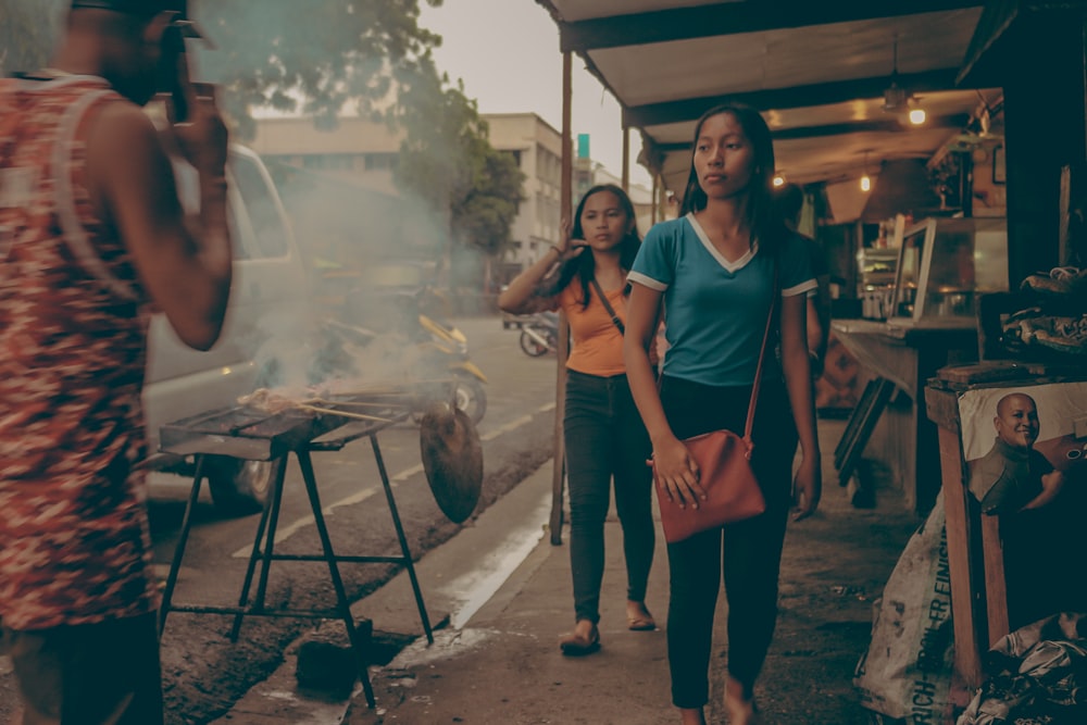 woman walking beside road