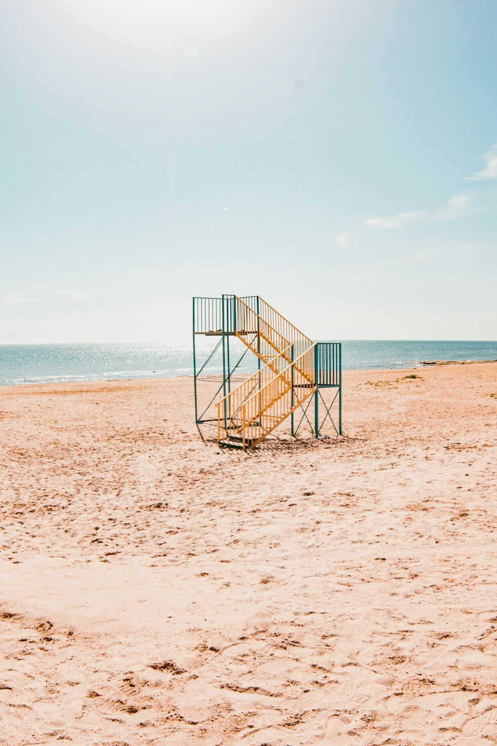 blue and yellow steel lifeguard post