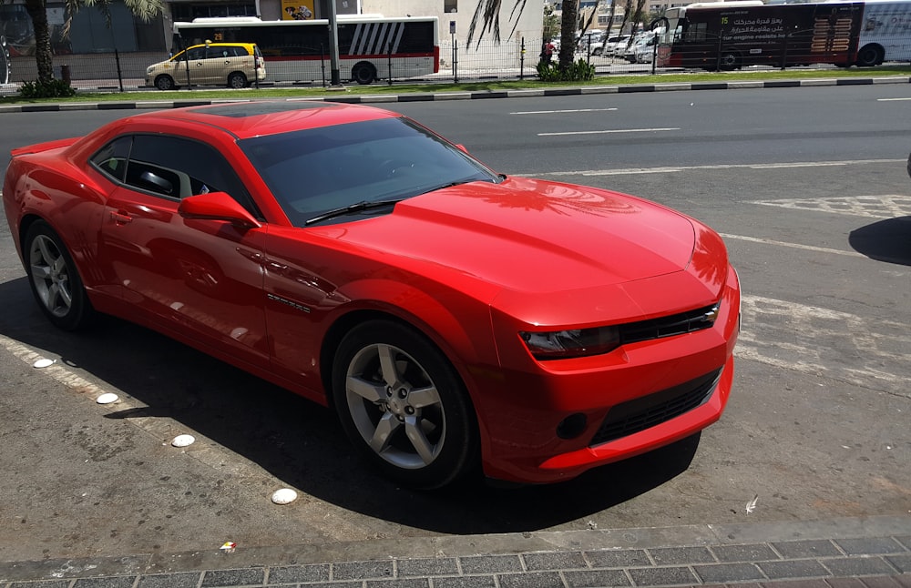 red Chevrolet coupe on road