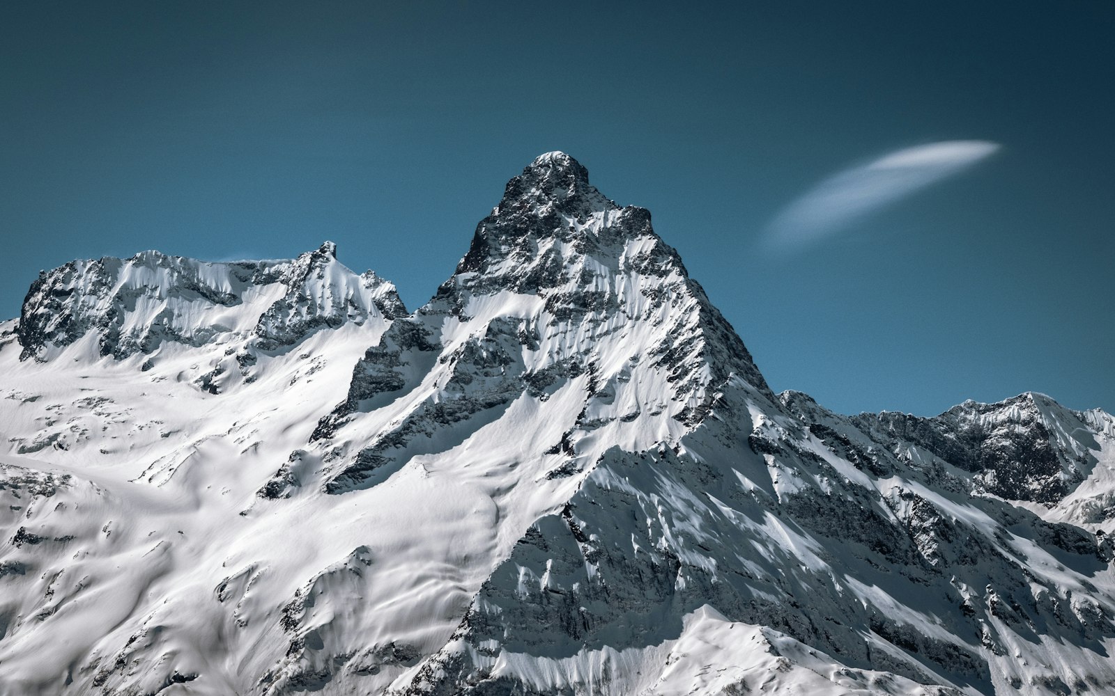 Sigma 17-70mm F2.8-4 DC Macro OS HSM sample photo. Snow-covered mountain photography