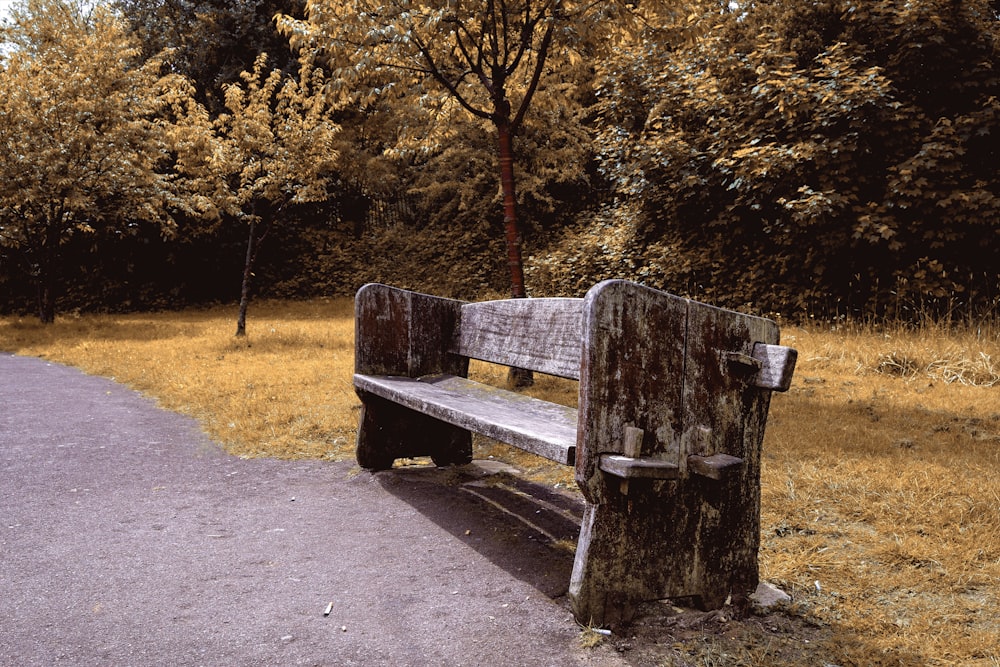 photo of brown wooden bench