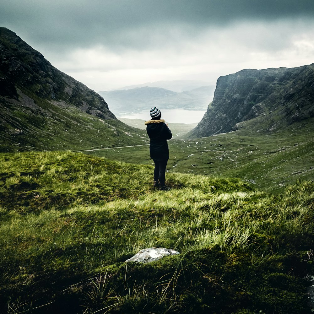 woman standing on green field