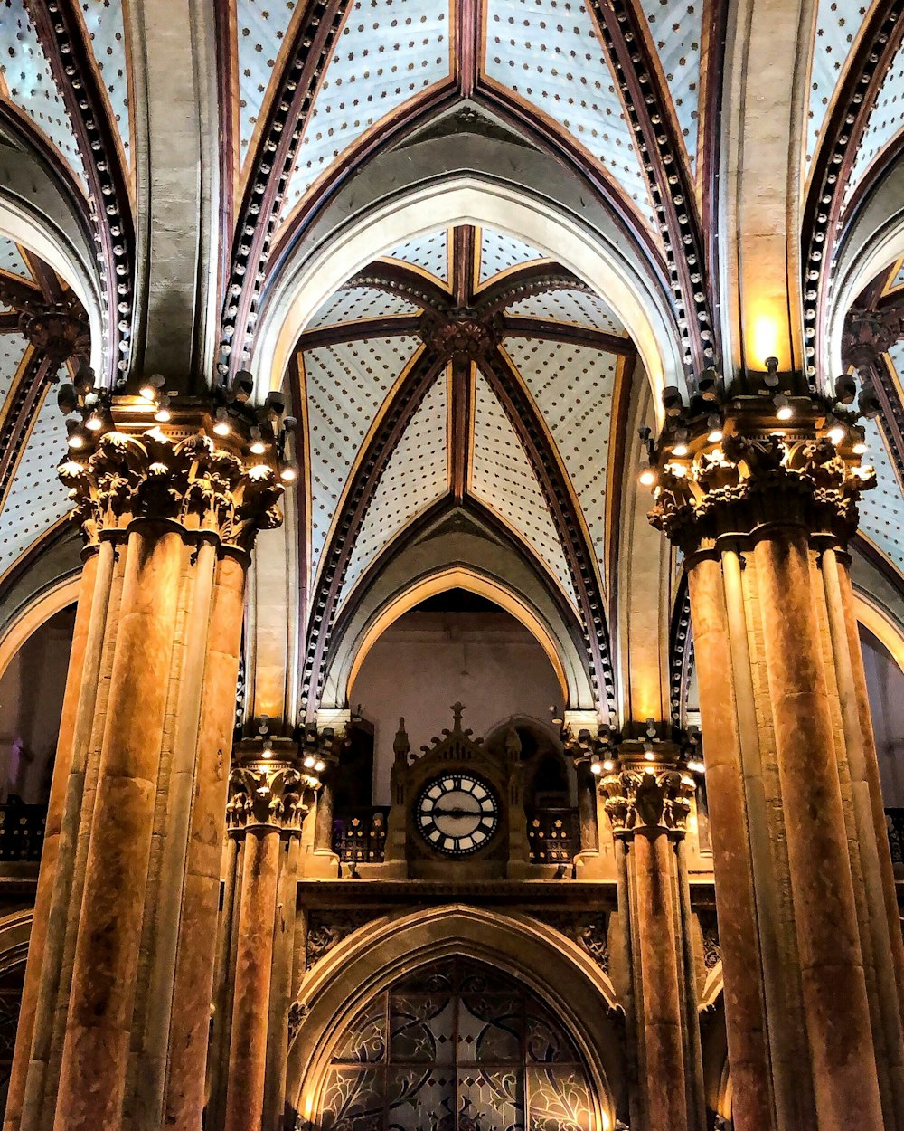 architectural photography of brown and white cathedral interior view