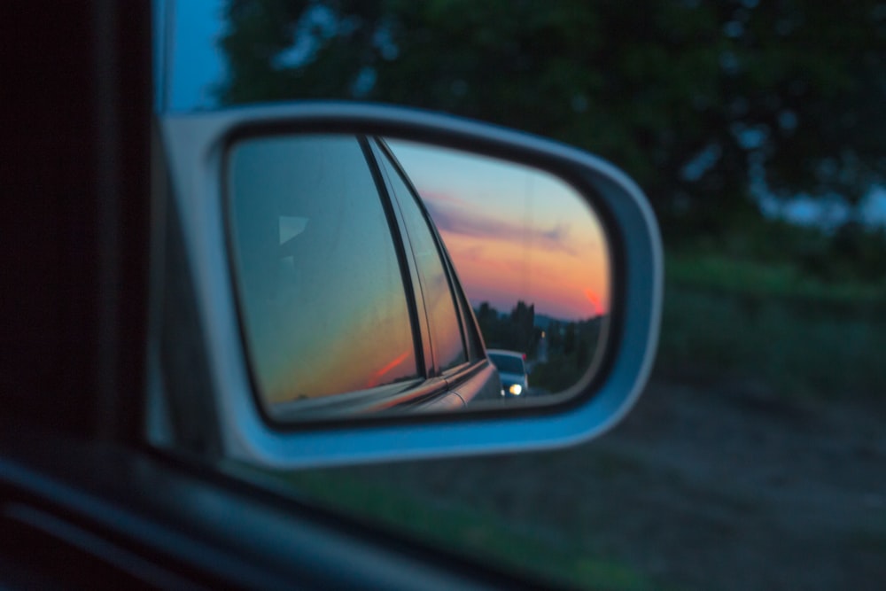 selective focus photography of vehicle side mirror