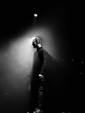 grayscale photography of unknown person standing