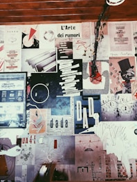 a wall covered in lots of different types of paper