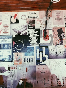 a wall covered in lots of different types of paper