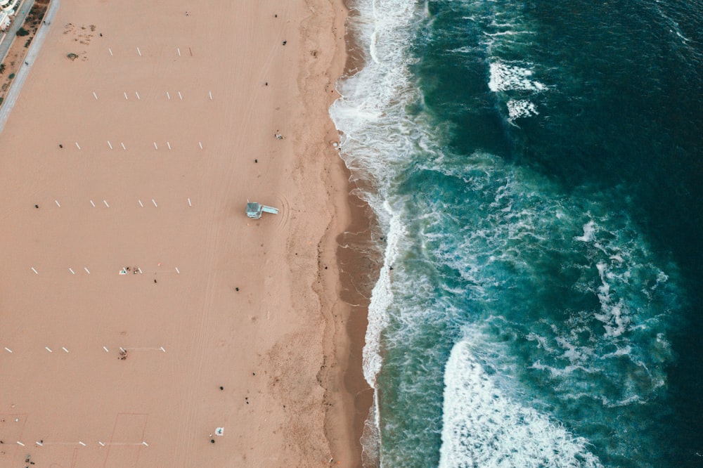 aerial photography of sea waves on shore